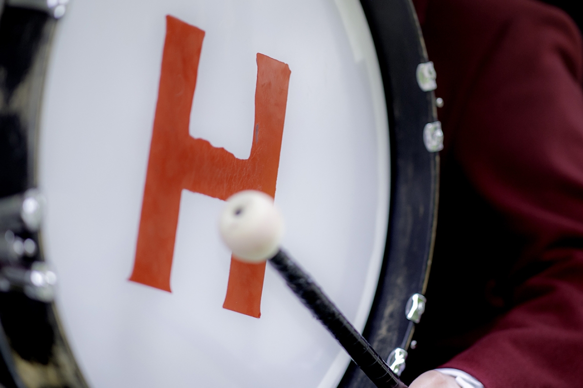 Harvard Christian Alumni Society - Drum with crimson H being played at Commencement
